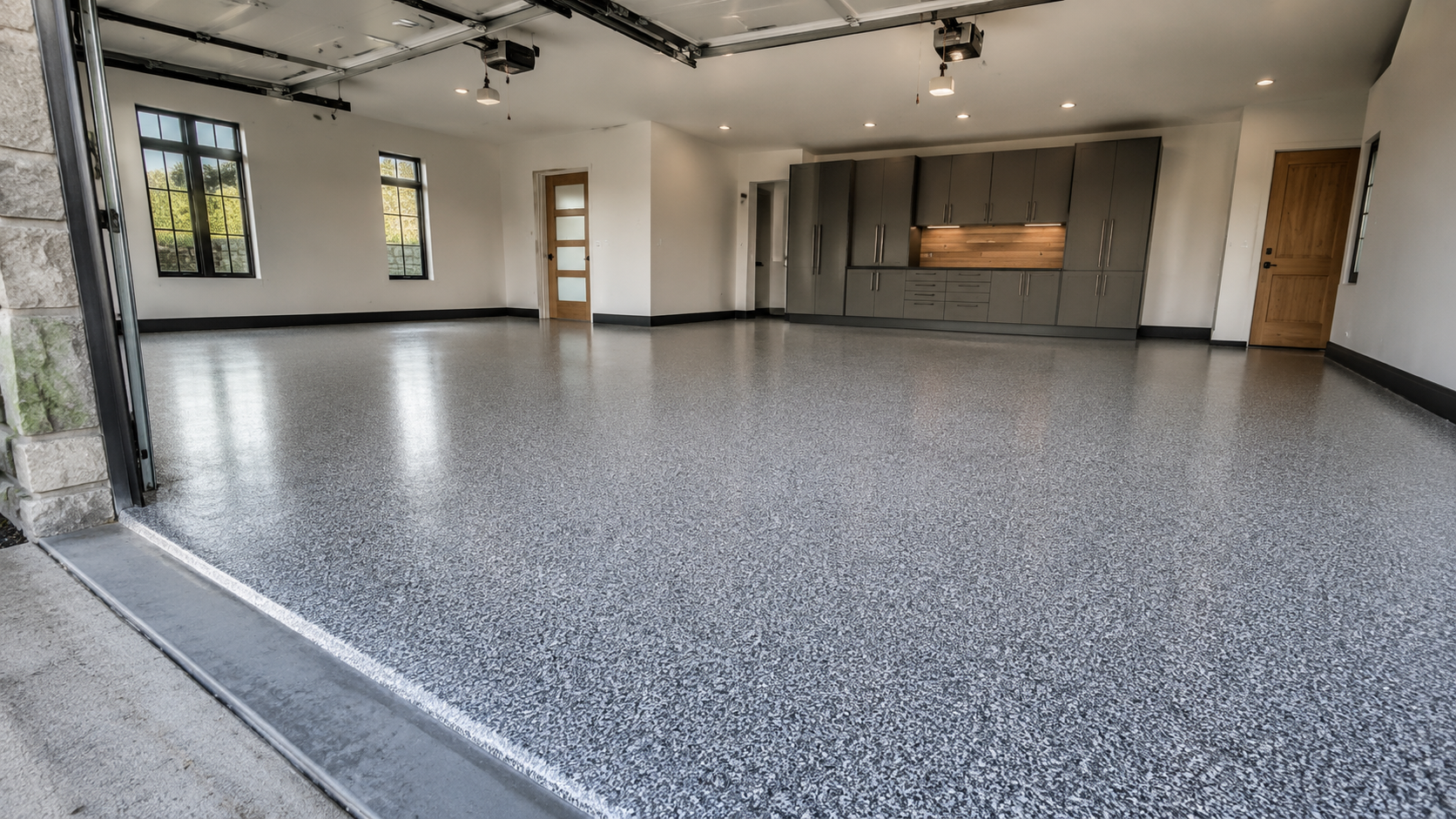 Gray flake epoxy garage floor coating in a newly built Huntsville, AL home
